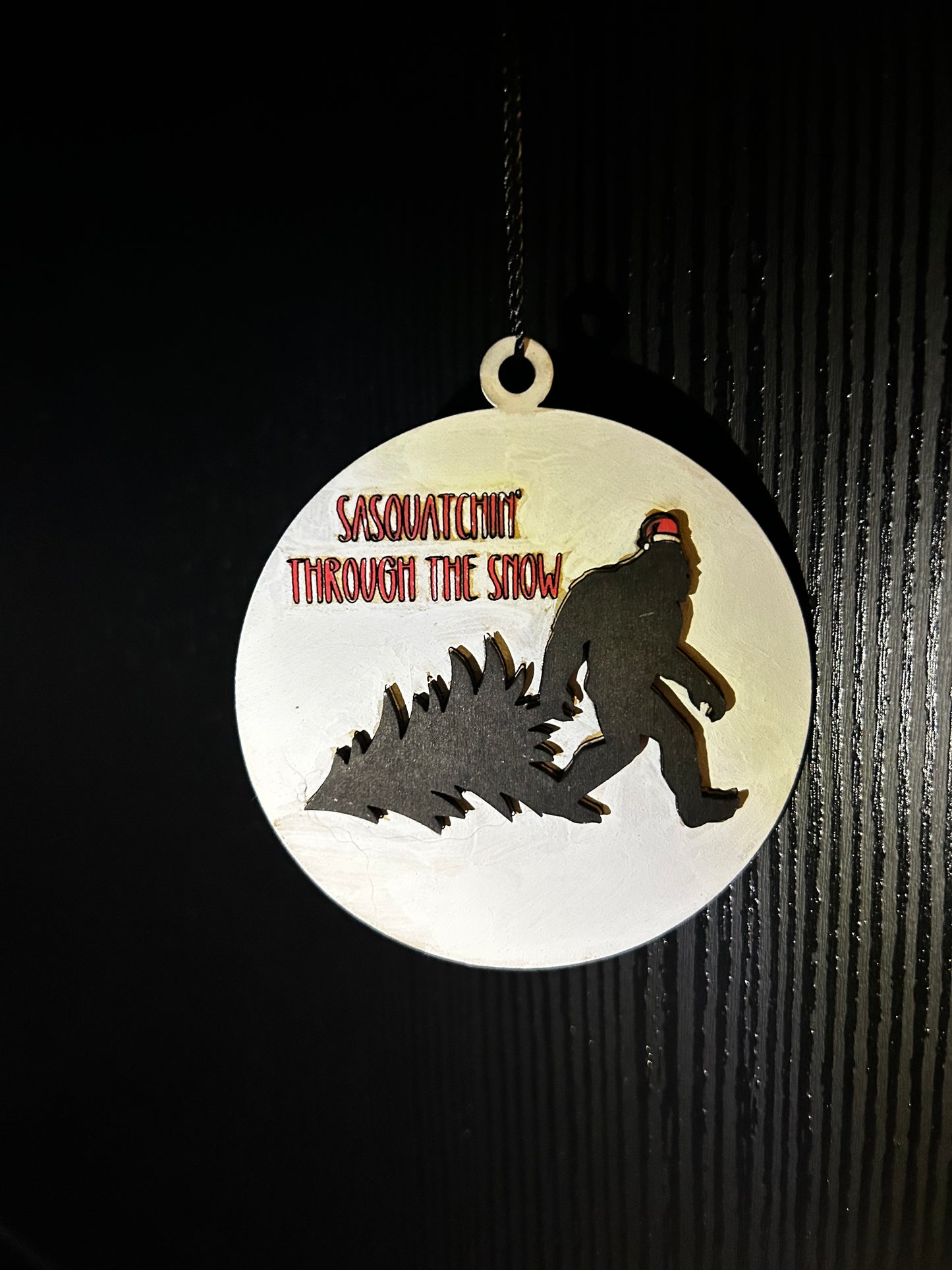 Sasquatchin through the snow ornament